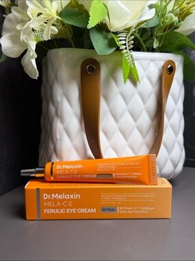 Dr. Melaxin MELA-C-E Ferulic Eye Cream — Vibrant Orange Tube